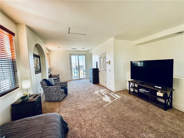 a bathroom with a granite countertop toilet sink and mirror