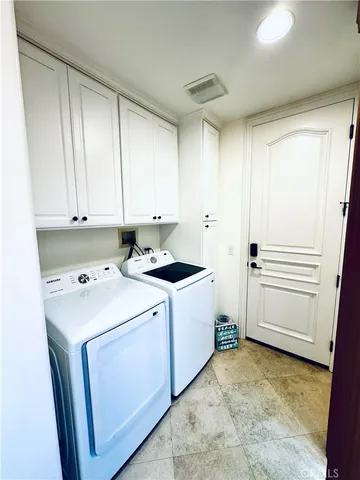 a view of a water heater room with a furniture