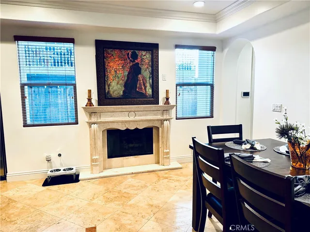 a dining room with a wooden table and chairs