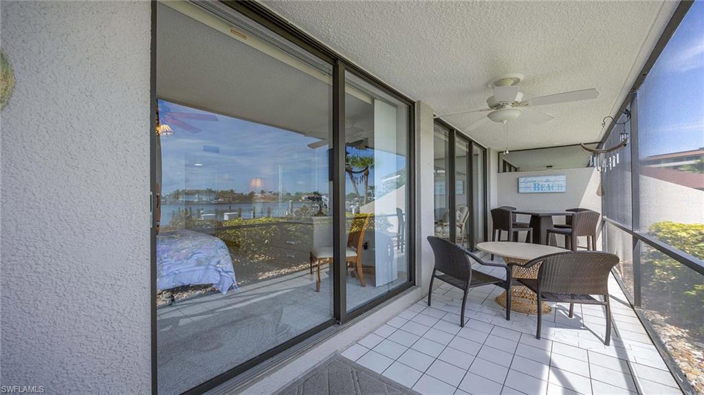 601 Seaview Court, Unit C106 Marco Island, FL 34145 - Photo 13 of 42 Sunroom with a ceiling fan