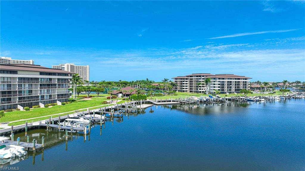 601 Seaview Court, Unit C106 Marco Island, FL 34145 - Photo 34 of 42 Water view with a floating dock and a marina