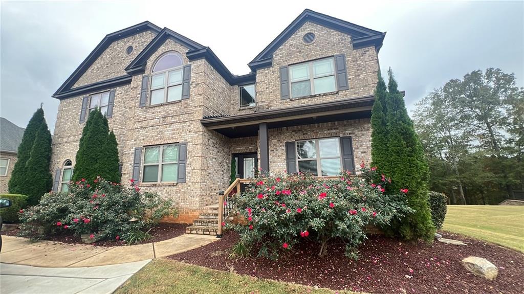 Undisclosed Address Locust Grove, GA 30248 - Photo 1 of 1 front view of a house with a yard