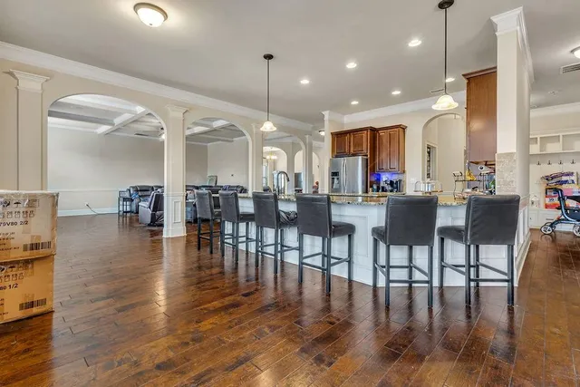 a view of entryway with wooden floor and stairs