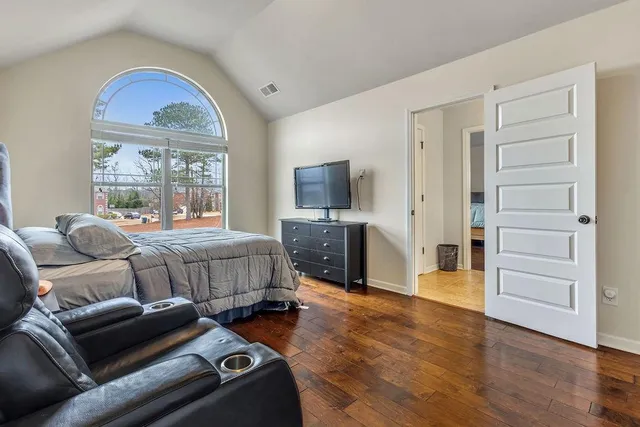 a white toilet sitting next to a shower curtain