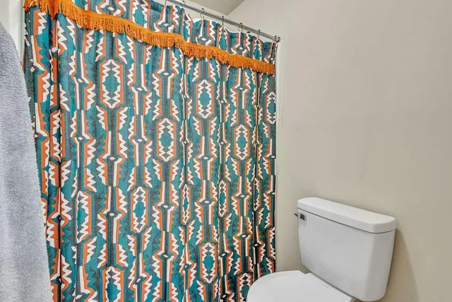 a view of a hallway with seating area