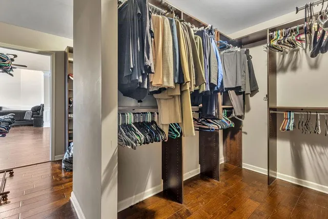 a bathroom with a glass door shower a sink and a mirror