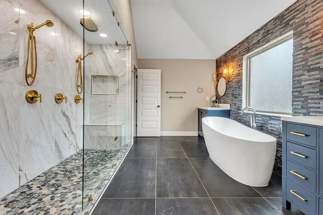 a utility room with sink dryer and washer