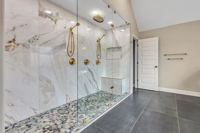 a living room with furniture a rug and a ceiling fan