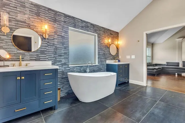 a projector room with furniture a fireplace and a flat screen tv