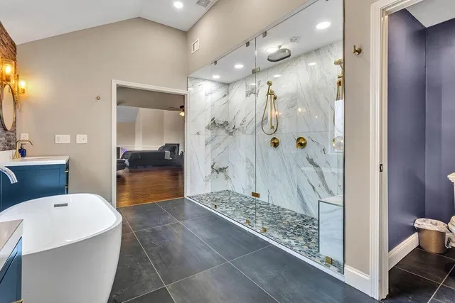 a living room with furniture a pool table and a large window