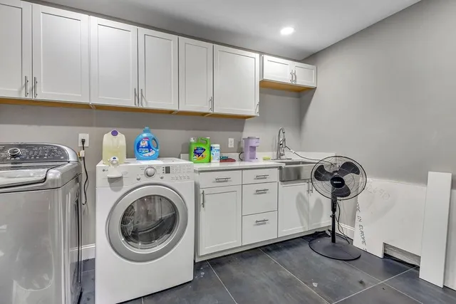 a living room with furniture and a wooden table