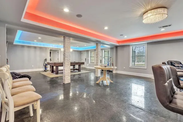 an aerial view of a house with table and chairs