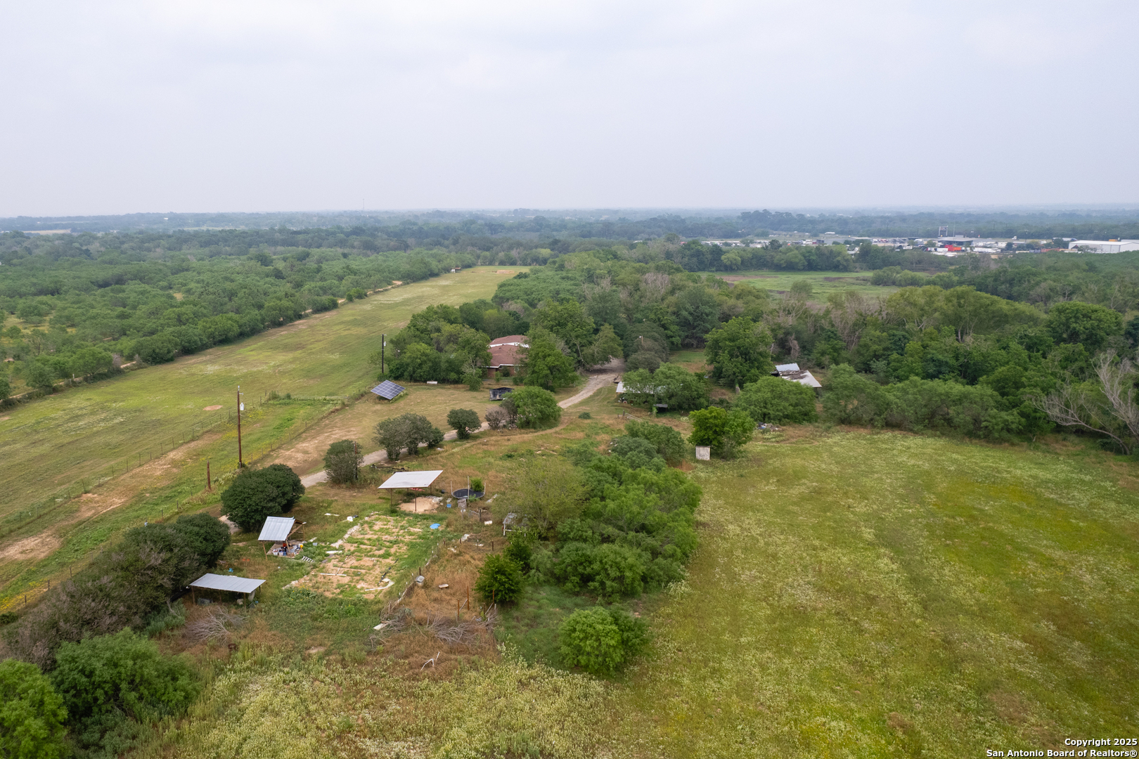 Tract 1 Shepherd Road Atascosa, TX 78002 - Photo 12 of 15 a view of a lake with a city