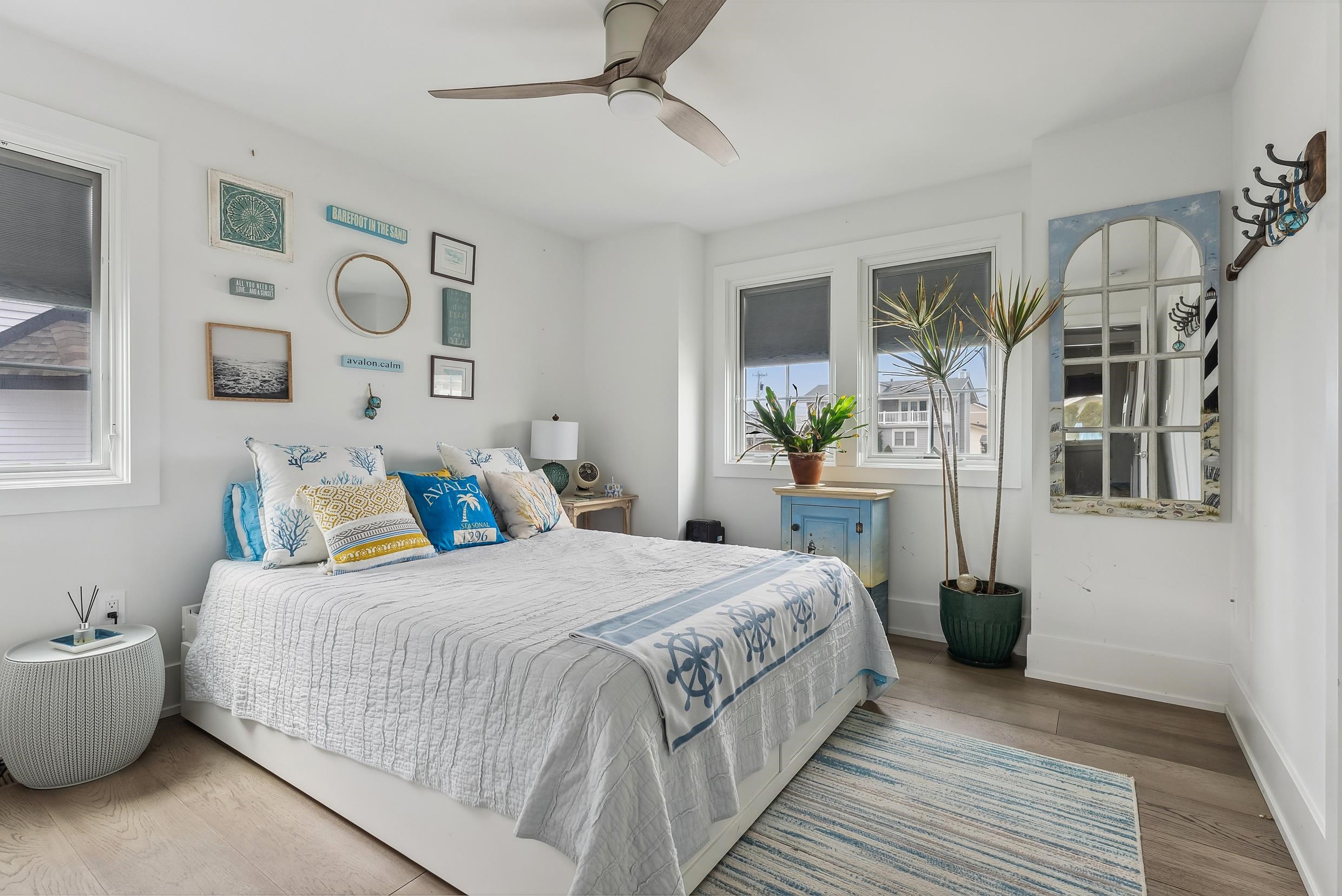 7749 Dune Drive Avalon, NJ 08202 - Photo 14 of 44 a bedroom with a bed and wooden floor