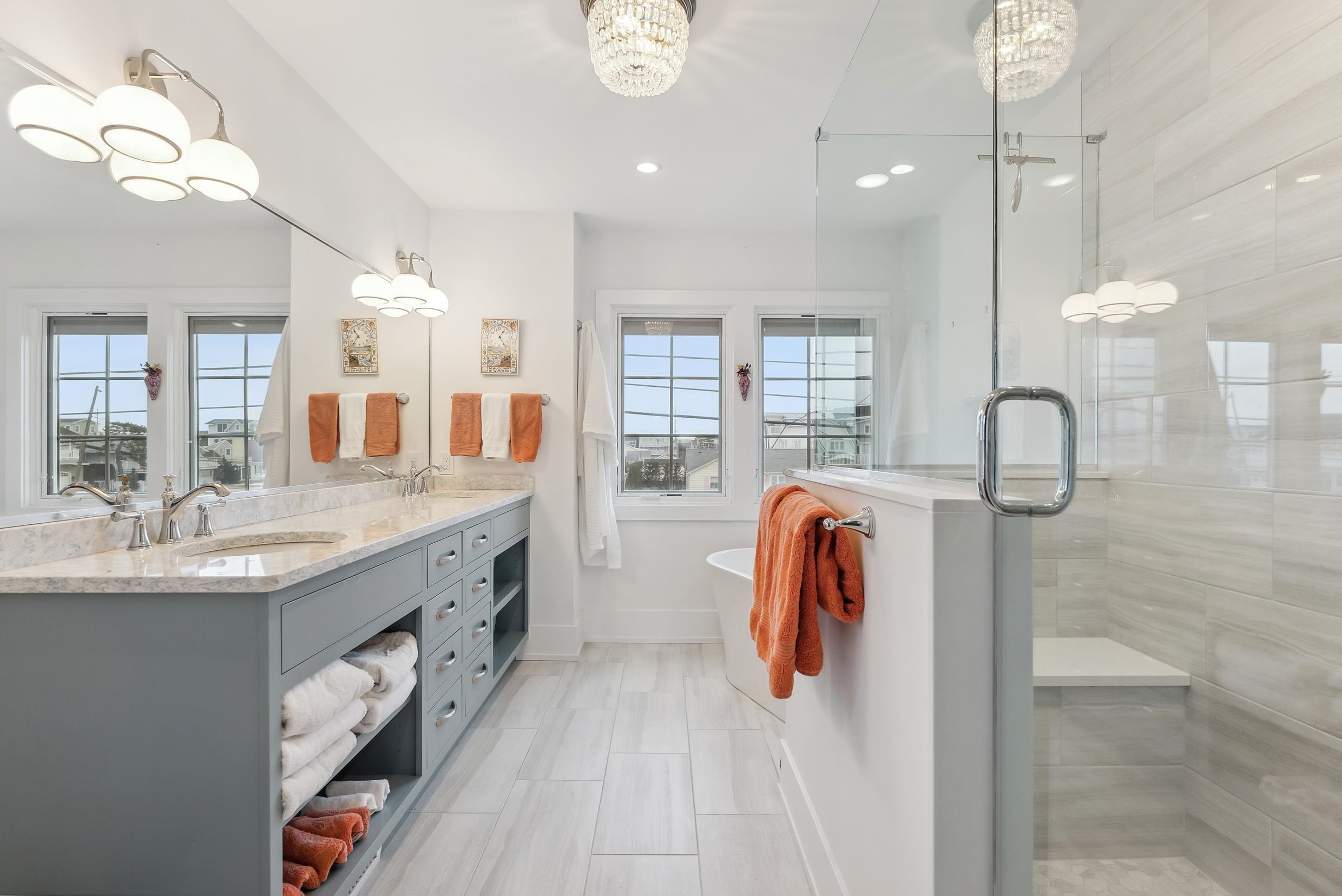 7749 Dune Drive Avalon, NJ 08202 - Photo 36 of 44 a bathroom with a sink and mirror