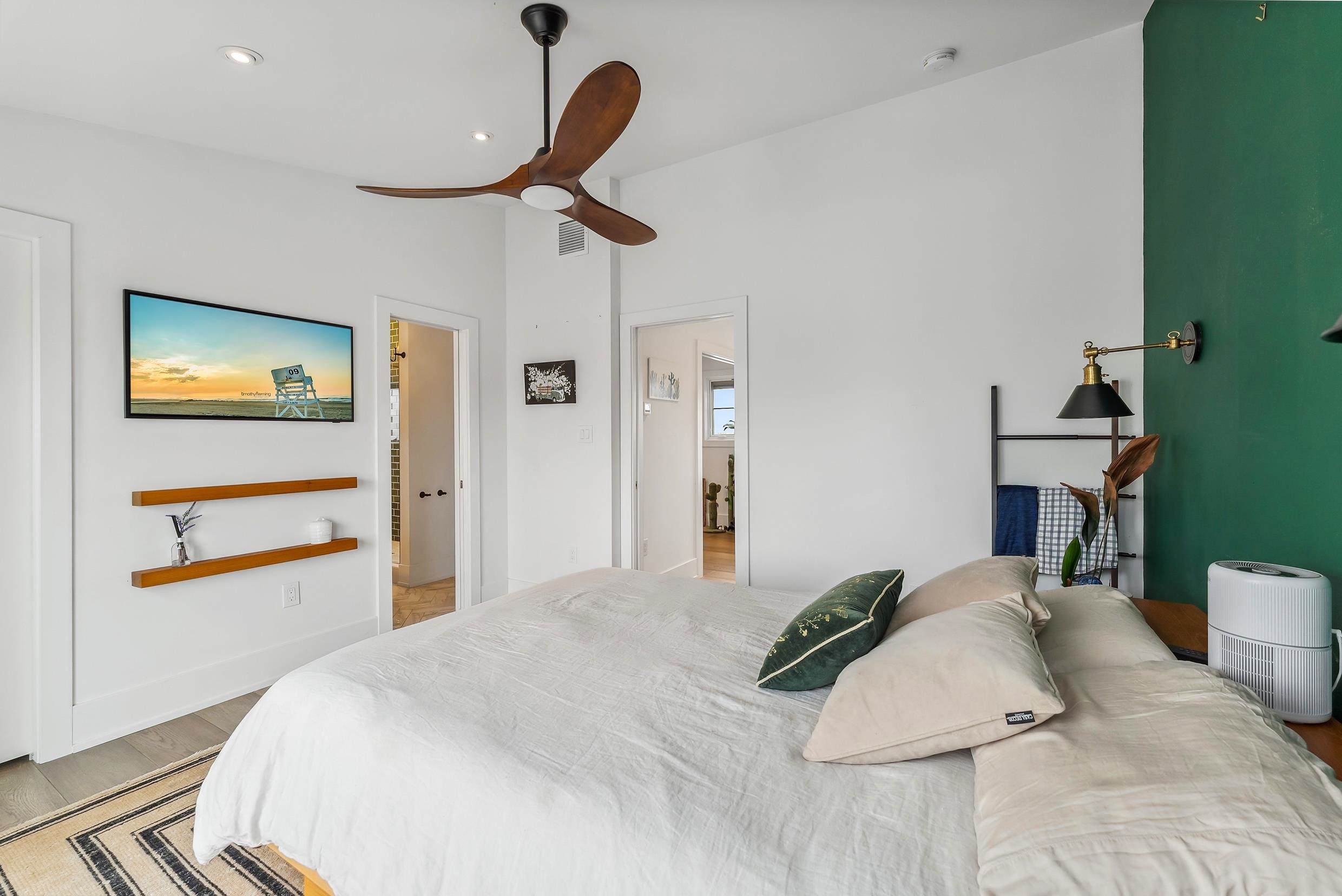 7749 Dune Drive Avalon, NJ 08202 - Photo 42 of 44 a bedroom with a bed and a chandelier