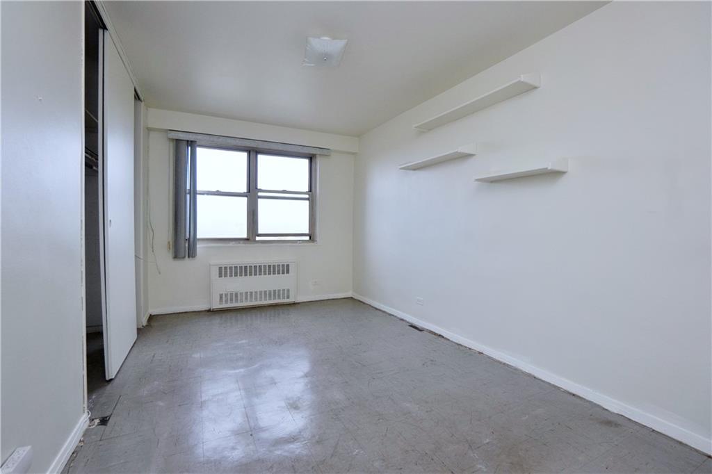 2483 West 16th Street, Unit 7H Brooklyn, NY 11214 - Photo 15 of 24 an empty room with windows