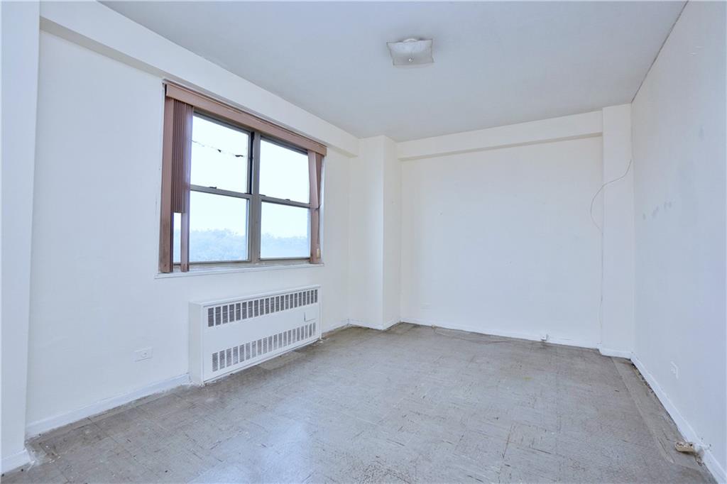2483 West 16th Street, Unit 7H Brooklyn, NY 11214 - Photo 23 of 24 an empty room with windows