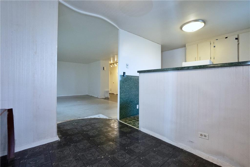 2483 West 16th Street, Unit 7H Brooklyn, NY 11214 - Photo 8 of 24 an empty room with a kitchen