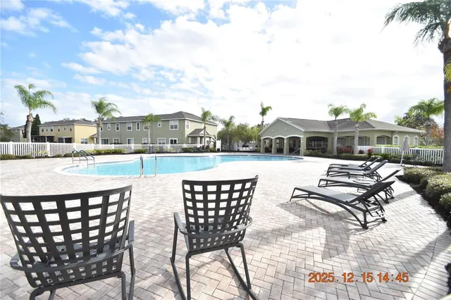 a front view of a house with a garden and trees