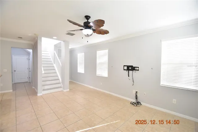 a view of a room with a window and chandelier