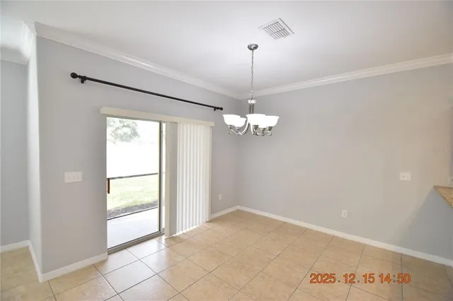 a view of a kitchen with kitchen island granite countertop a sink and refrigerator