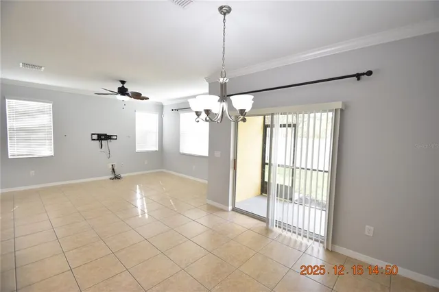 a kitchen with stainless steel appliances granite countertop a sink and a refrigerator