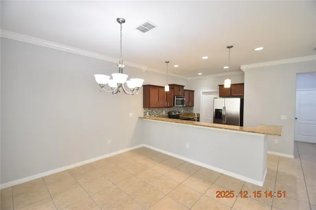 a kitchen with a refrigerator and a sink