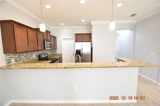 a bathroom with a granite countertop sink a mirror and vanity