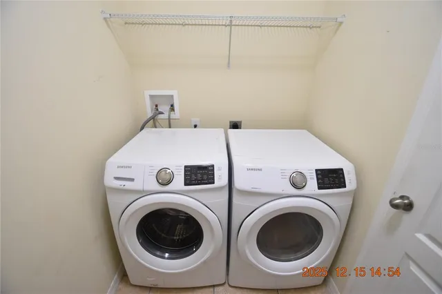 a view of an empty room with a window and a ceiling fan