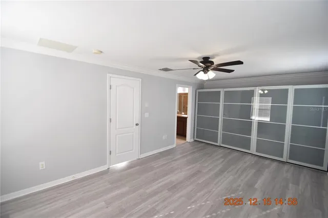 a view of walk in closet with empty racks