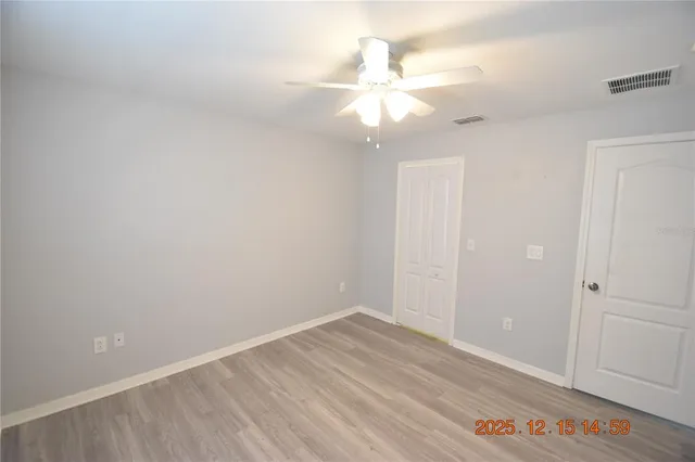 a view of a swimming pool with a yard and sitting space