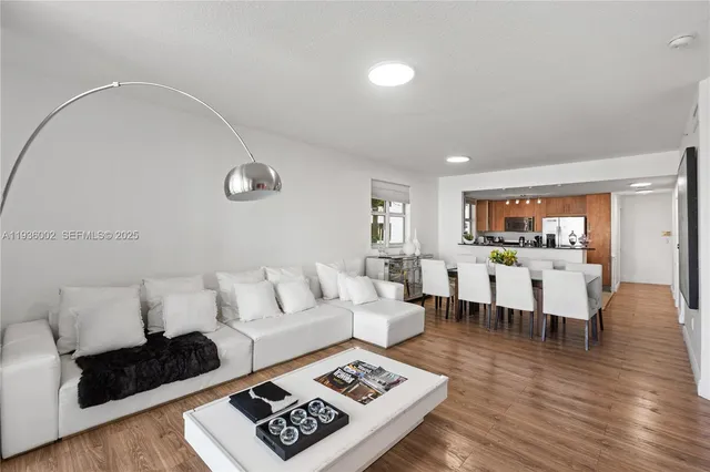 a living room with furniture rug and window