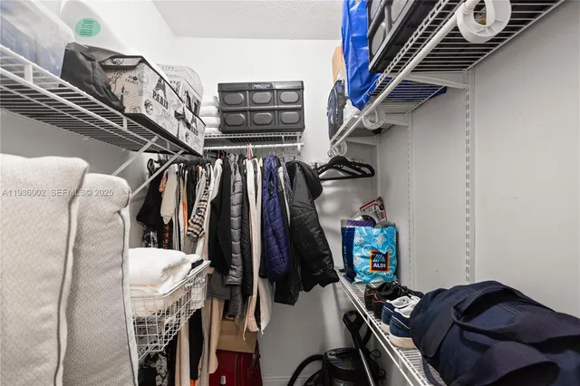 a view of living room filled with furniture and wooden floor