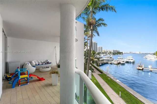 a living room filled with furniture and a potted plant