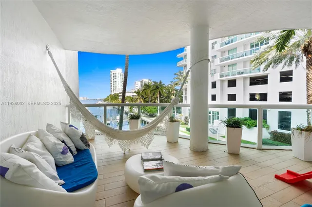 a view of livingroom with furniture wooden floor and windows