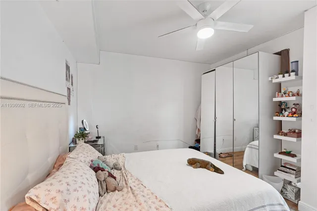 a bedroom with a bed and a closet