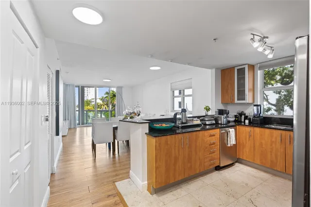 a kitchen with lots of counter top space and living room