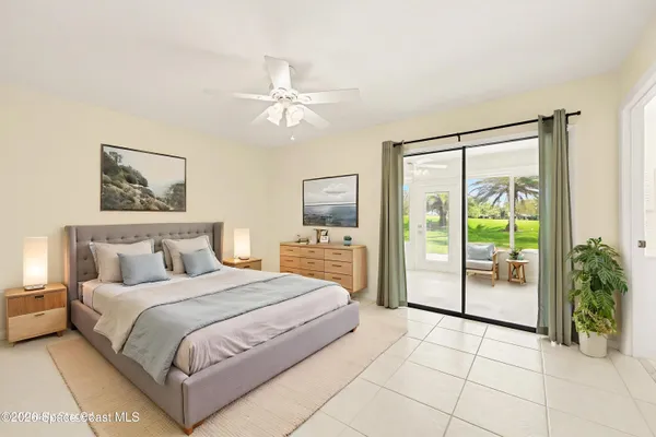 a bathroom with a double vanity sink a mirror and a bathtub