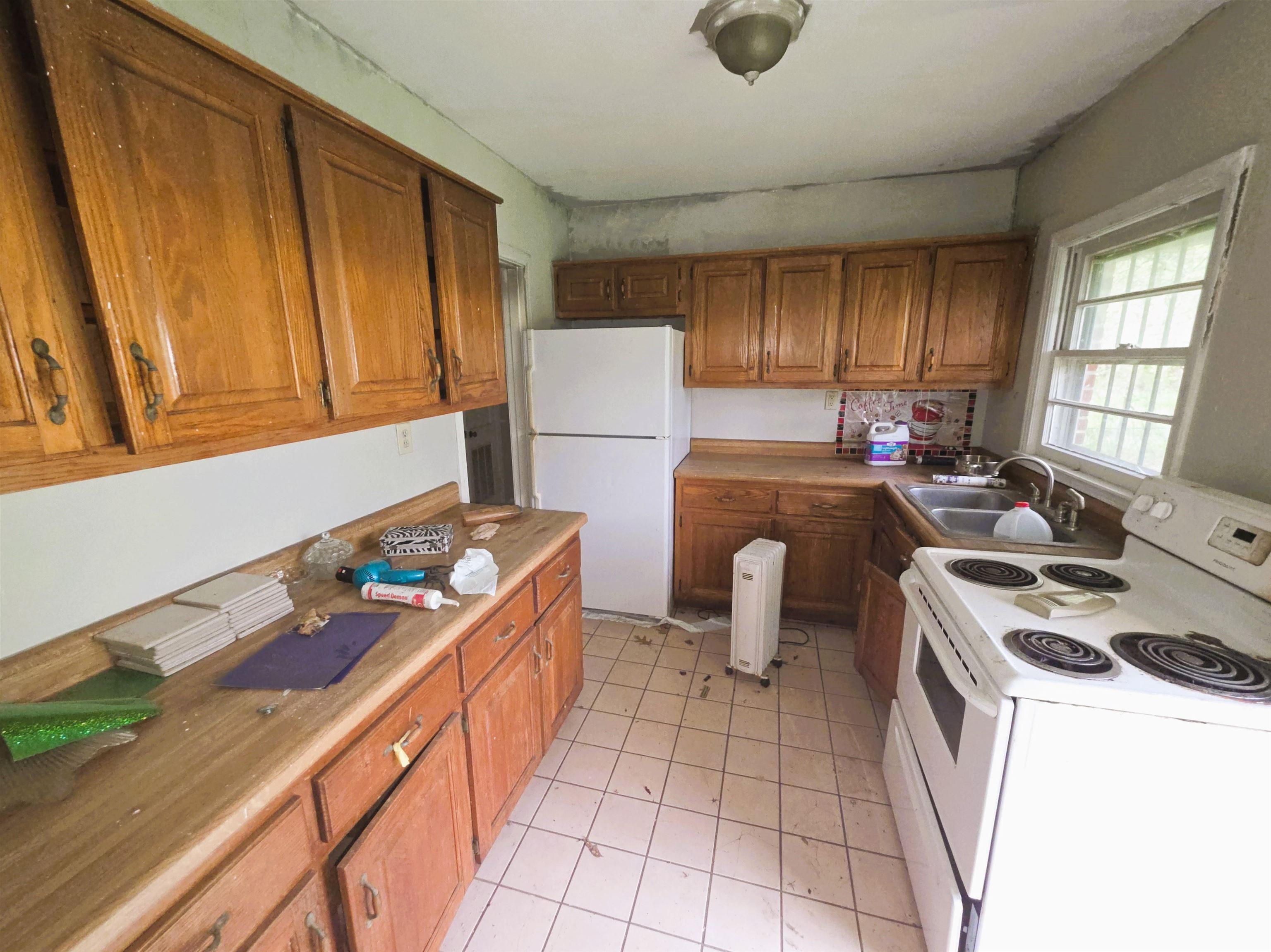 6751 Navy Road Millington, TN 38053 - Photo 5 of 14 a kitchen with a cabinets and a stove top oven