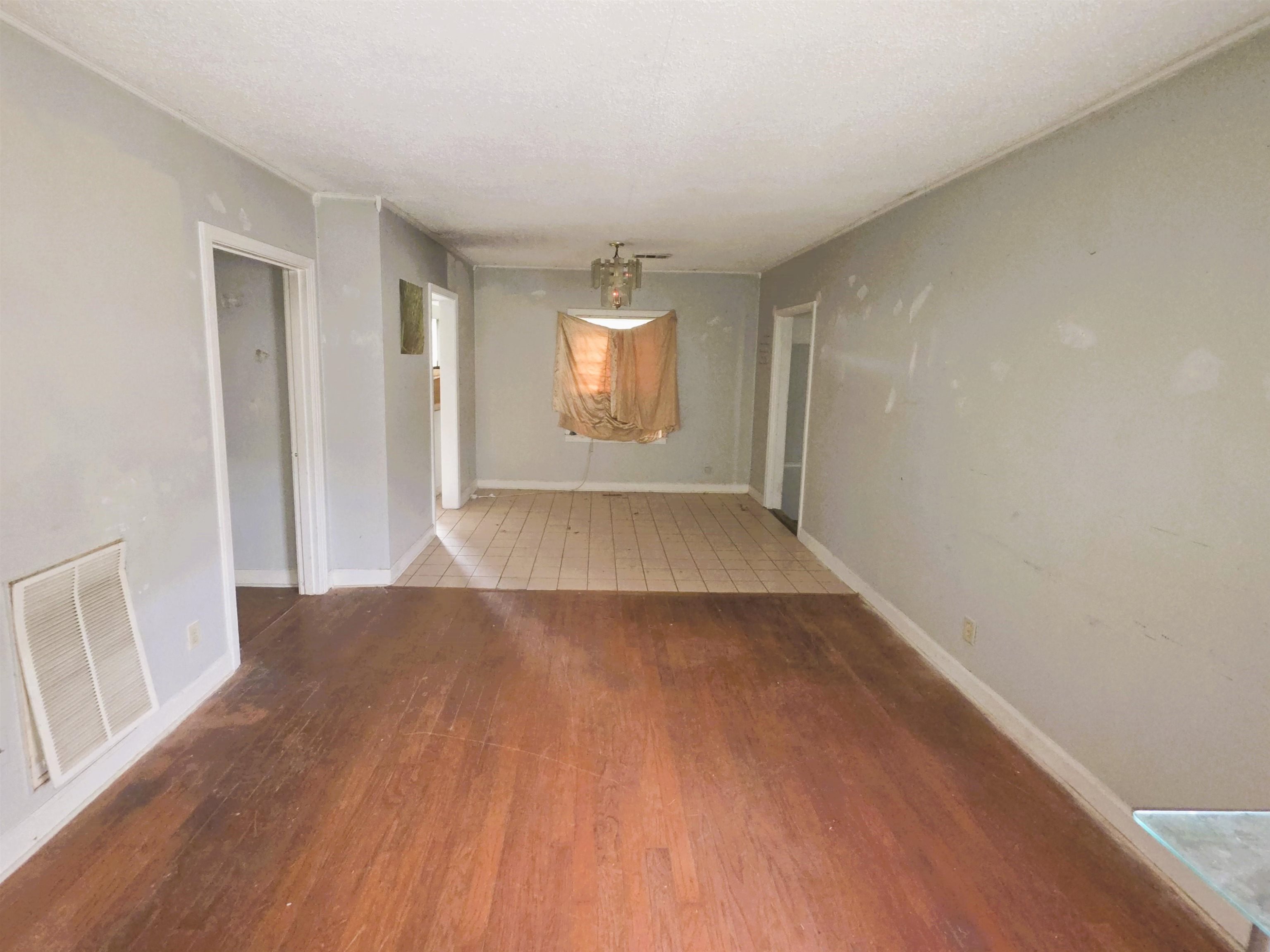6751 Navy Road Millington, TN 38053 - Photo 6 of 14 an empty room with wooden floor and windows