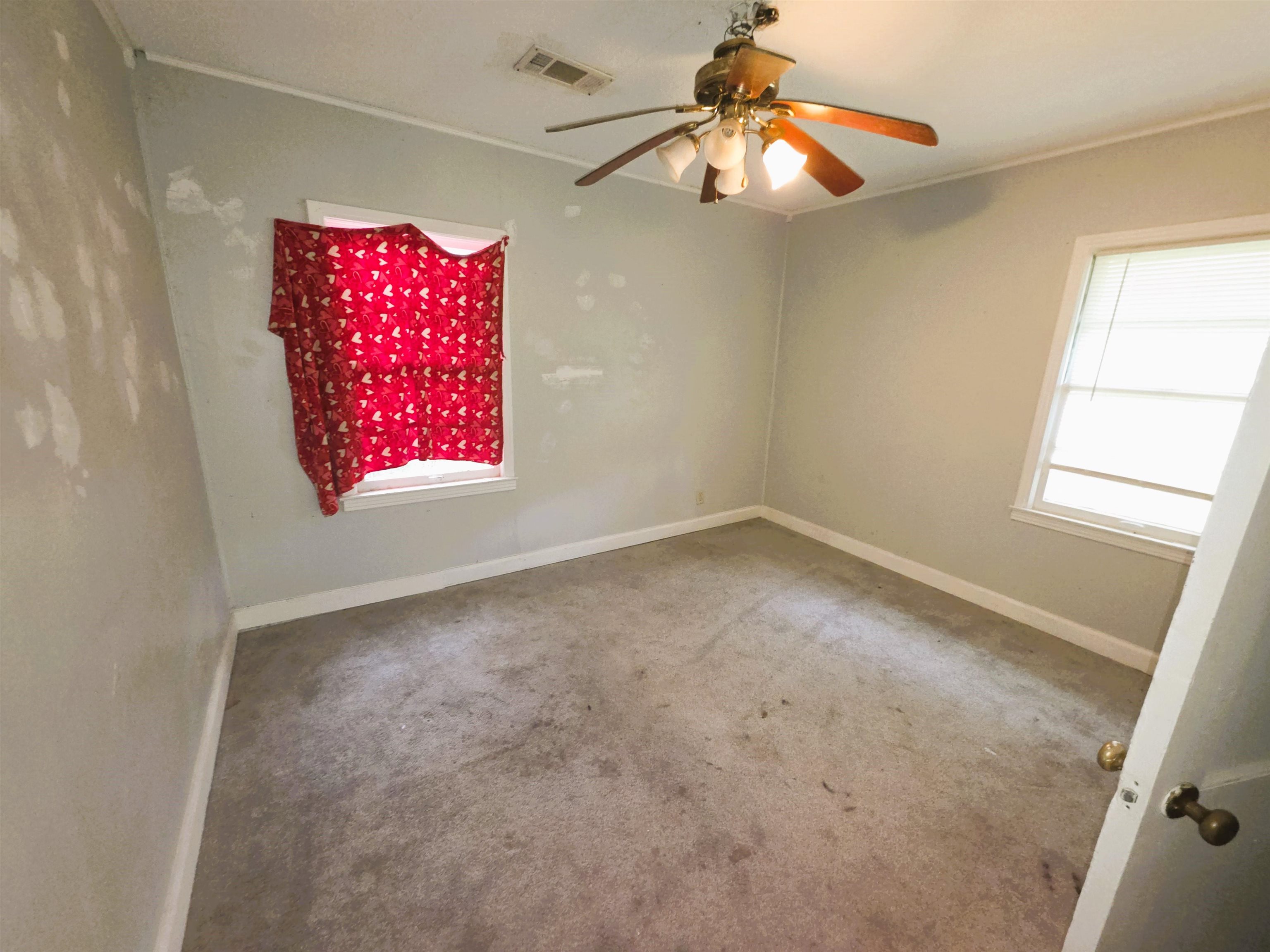 6751 Navy Road Millington, TN 38053 - Photo 10 of 14 en empty room with windows and fan