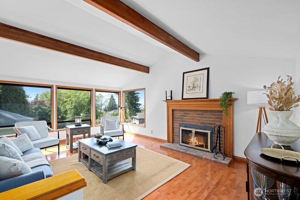 902 7th Avenue South Edmonds, WA 98020 - Photo 5 of 31 a living room with furniture a large window and a fireplace