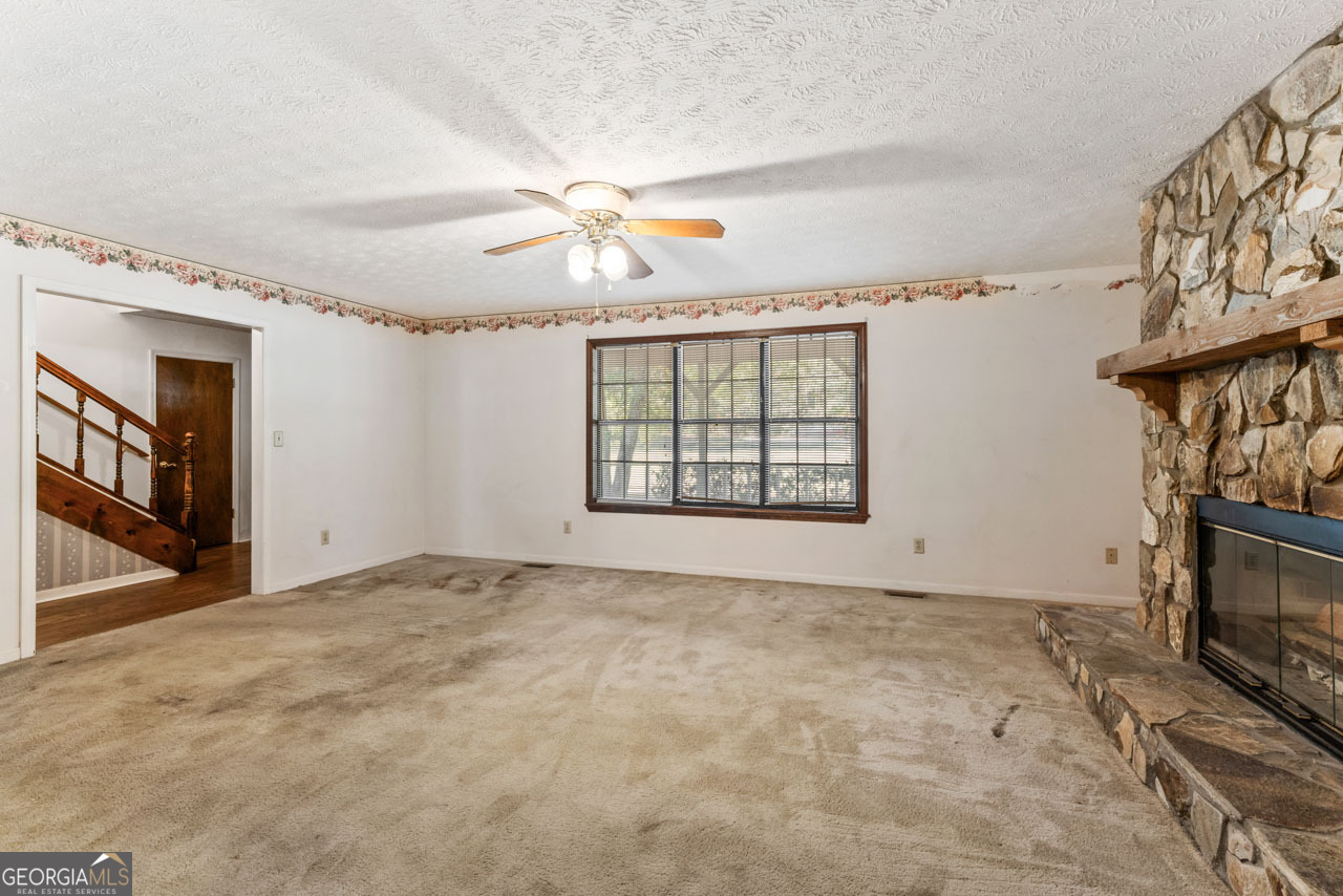 75 Antioch Road McDonough, GA 30252 - Photo 11 of 40 a view of an empty room with window and fireplace