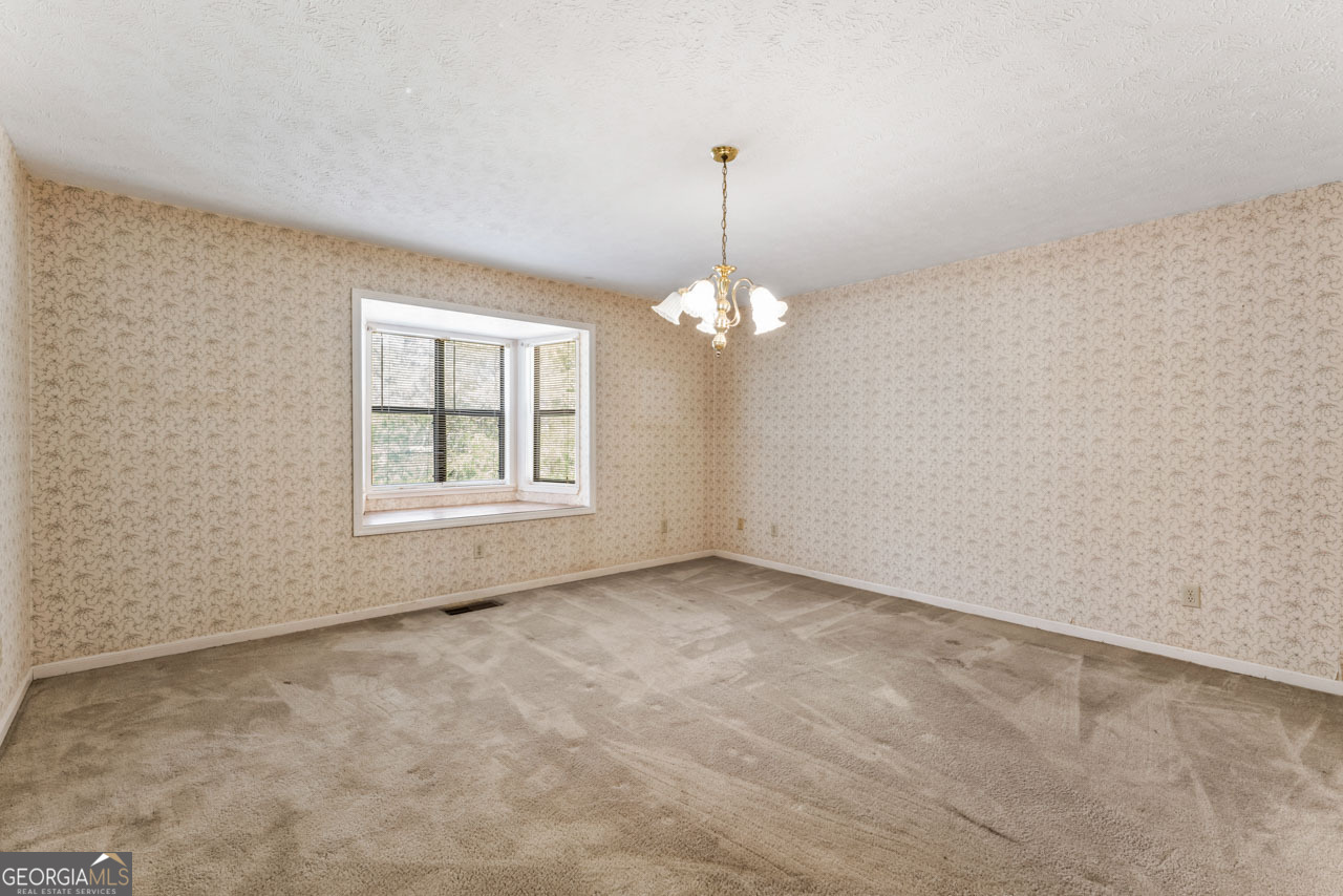 75 Antioch Road McDonough, GA 30252 - Photo 12 of 40 a view of an empty room with a window
