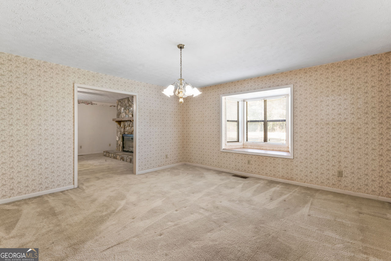 75 Antioch Road McDonough, GA 30252 - Photo 13 of 40 a view of an empty room with a window