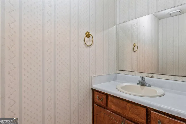 a bathroom with a sink and a mirror