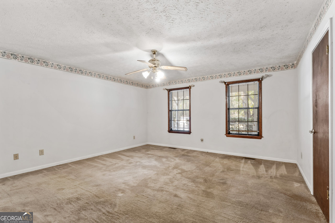 75 Antioch Road McDonough, GA 30252 - Photo 16 of 40 a view of an empty room with windows