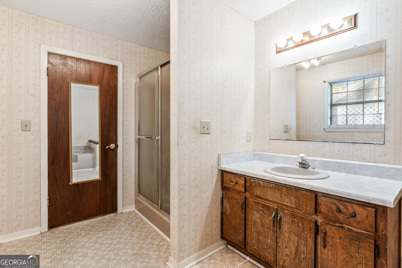 75 Antioch Road McDonough, GA 30252 - Photo 19 of 40 a bathroom with a sink and a mirror