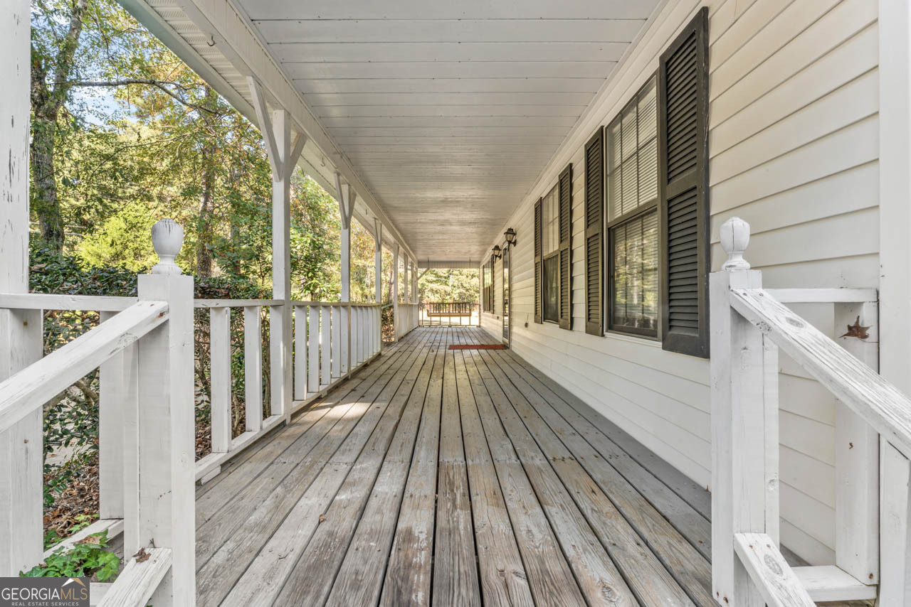 75 Antioch Road McDonough, GA 30252 - Photo 2 of 40 a view of balcony with wooden floor and fence